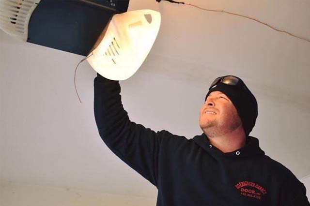Our owner Phil Koehlinger repairing a garage door opener