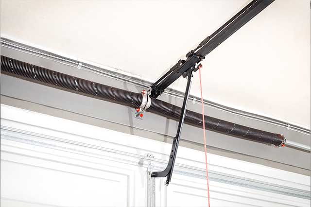 Our tech repairing a garage door roller track